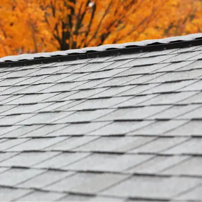Close-up view of a ridge vent along an asphalt shingle roof