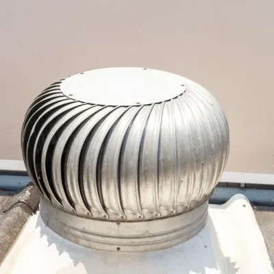 A roof ventilation system featuring a metal turbine ventilator, designed to expel hot air from the attic and improve airflow.
Image 2 Title: asphalt-shingle-roof-close-up-detail