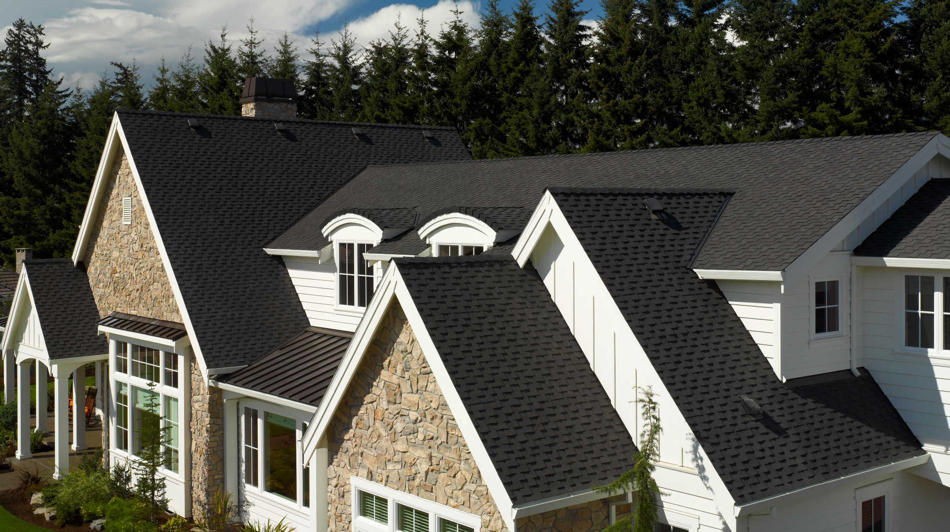 A large home with a beautiful new CertainTeed shingle roof installed by Bill West Roofing.