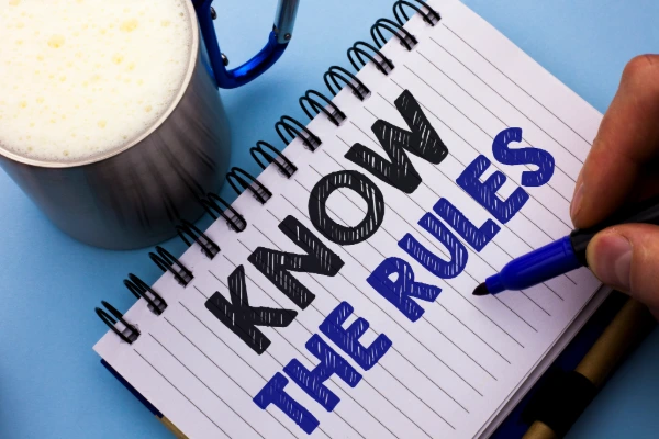 Homeowner reviewing HOA rules and regulations for roof replacement approval process