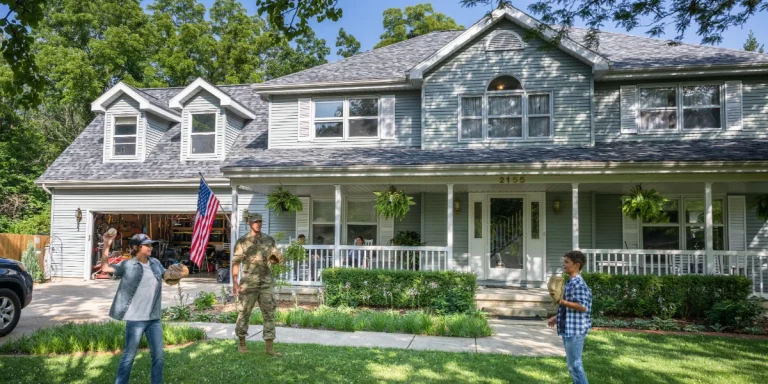 A military family playing catch in front of a well-maintained two-story home with a clean asphalt shingle roof in Kansas City.