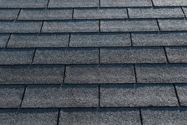 Dark gray 3-tab asphalt shingles.